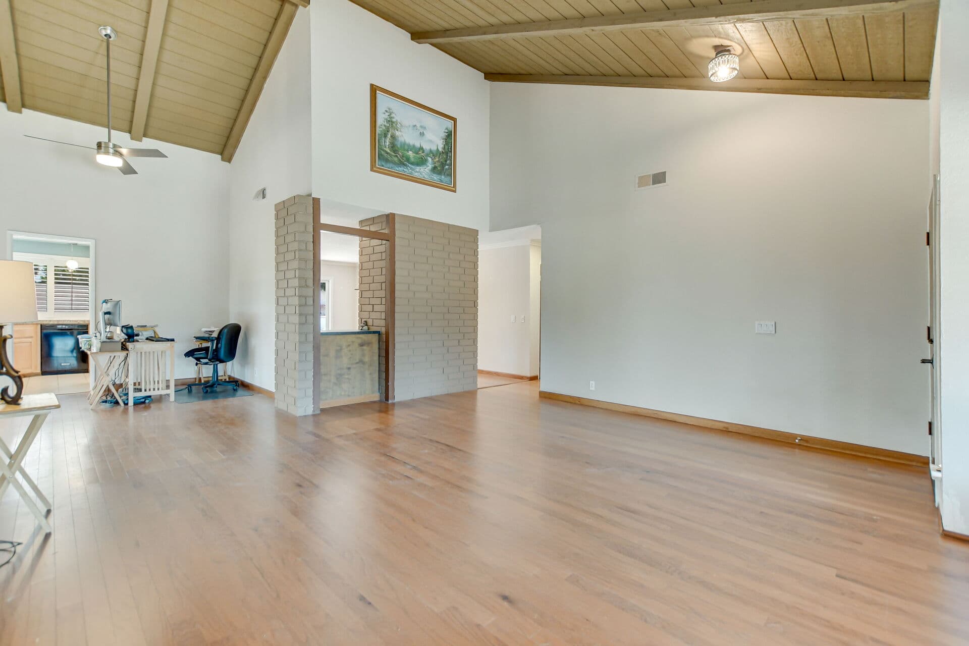 Open vaulted-ceiling living room in a Claremont home, the kind of space buyers walk through at an open house