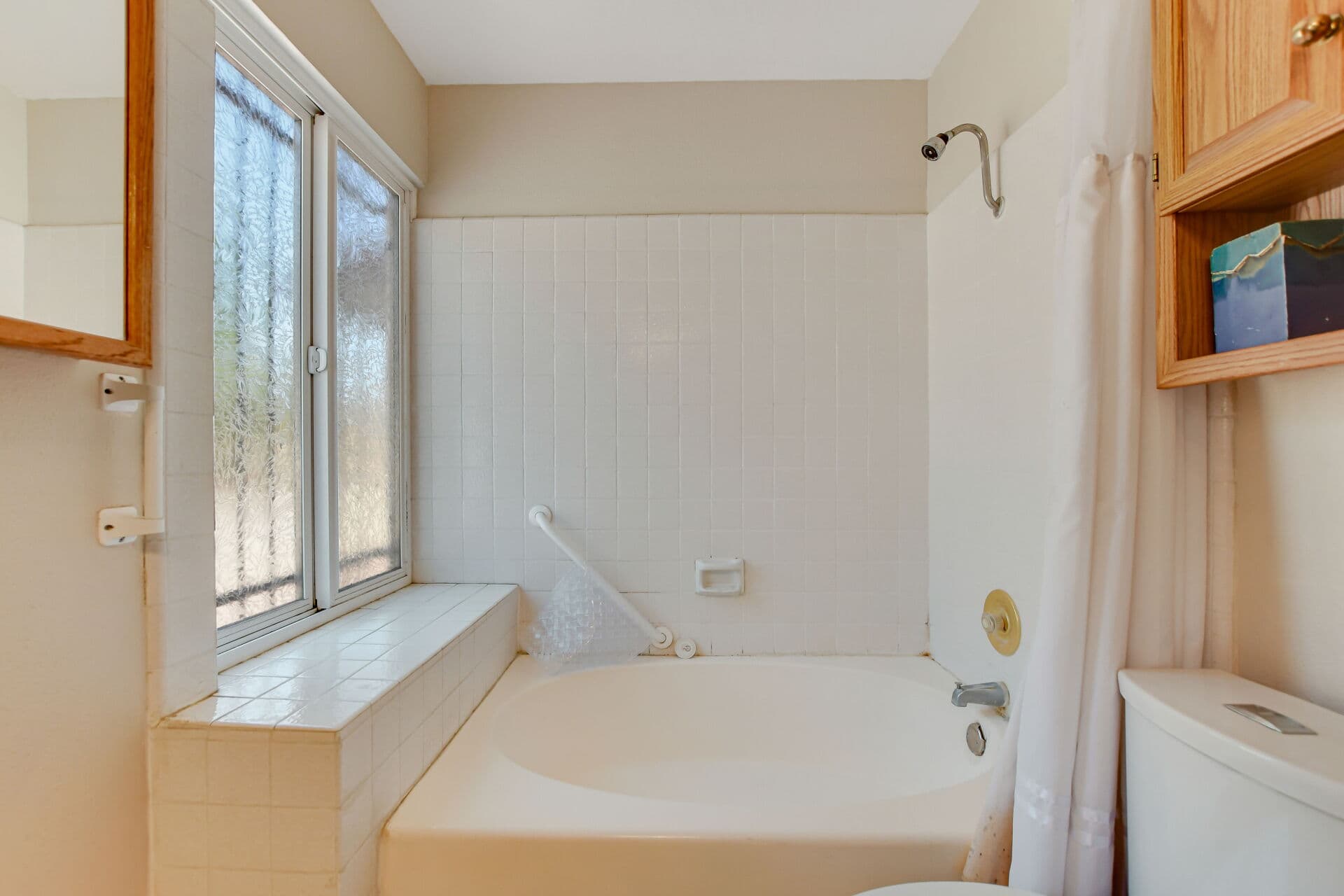Claremont bathroom with tub, tile surround, and fixtures of the kind a home inspector tests