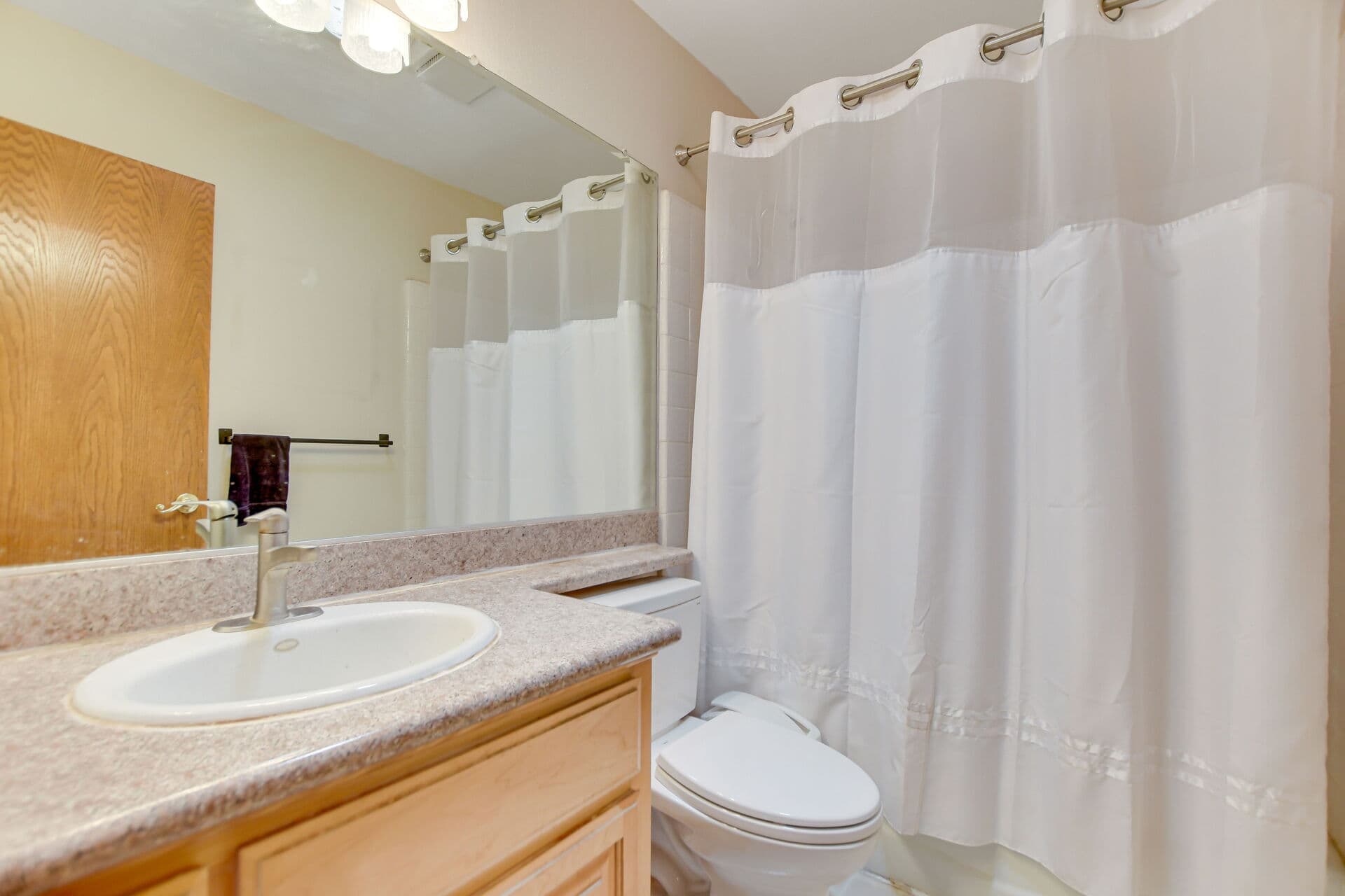 Hall bathroom with vanity in a Claremont home