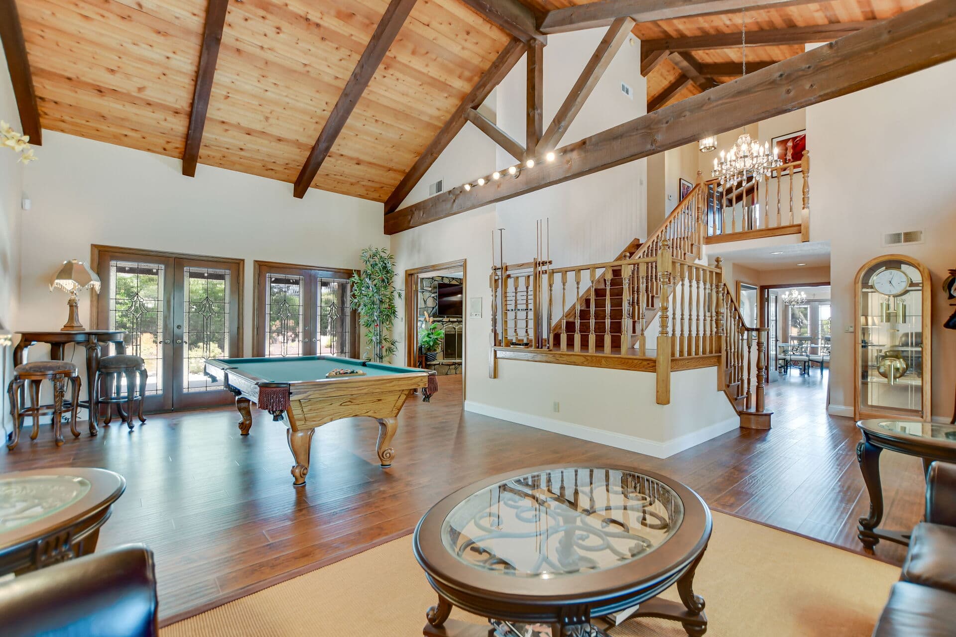 Vaulted gathering room with staircase in a Claremont home