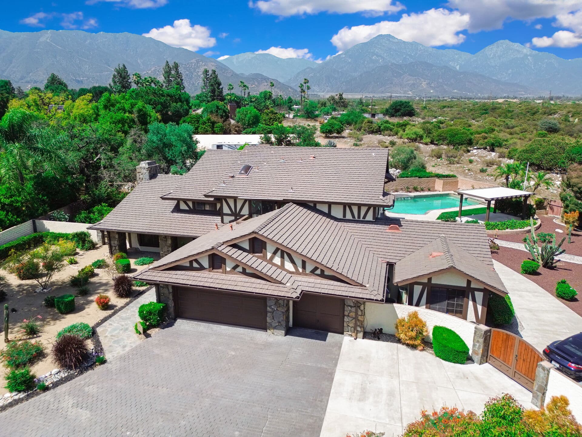 Aerial view of a Claremont home with pool and the San Gabriel Mountains beyond