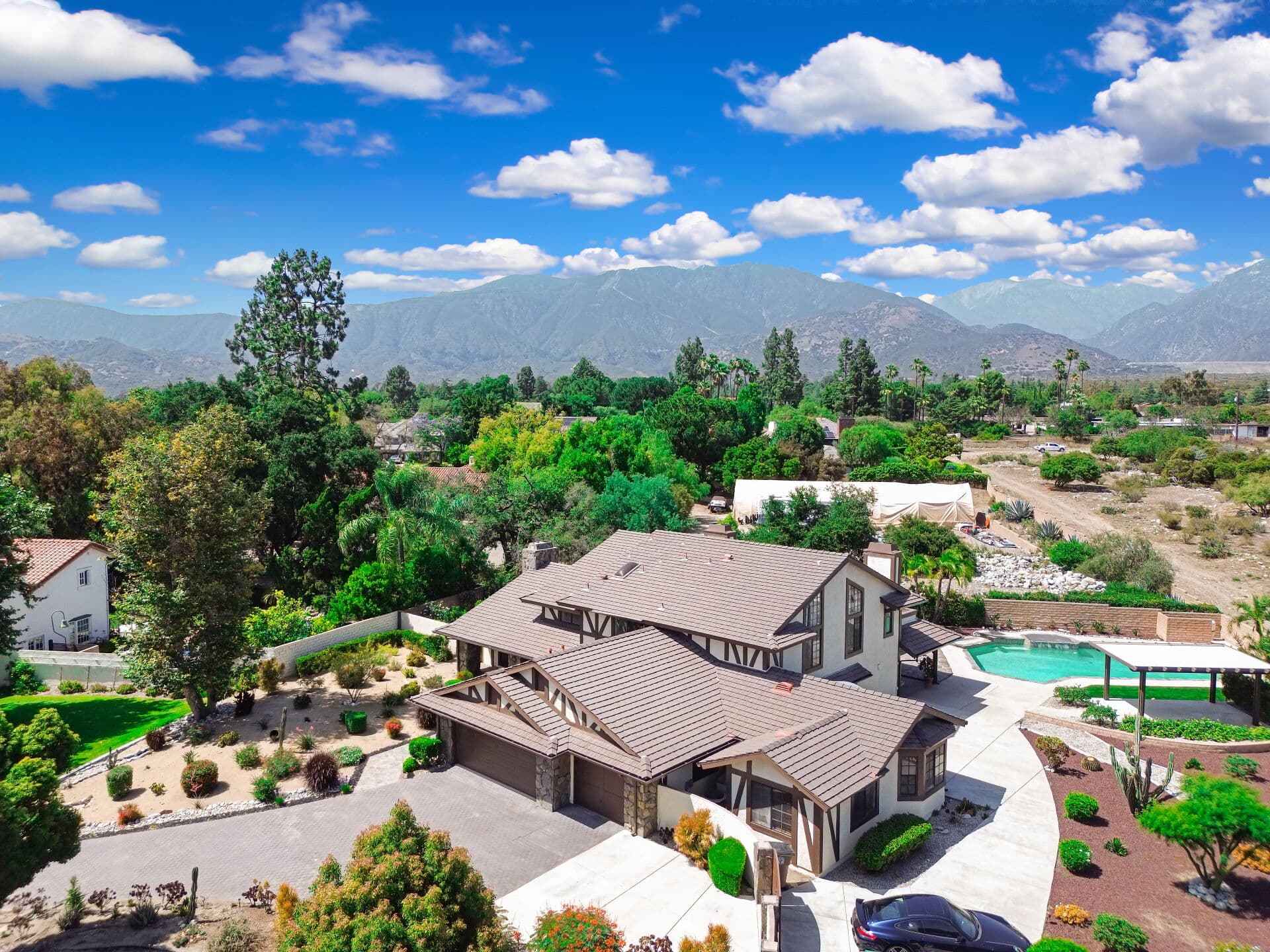 Aerial view over a Claremont property with the San Gabriel Mountains beyond