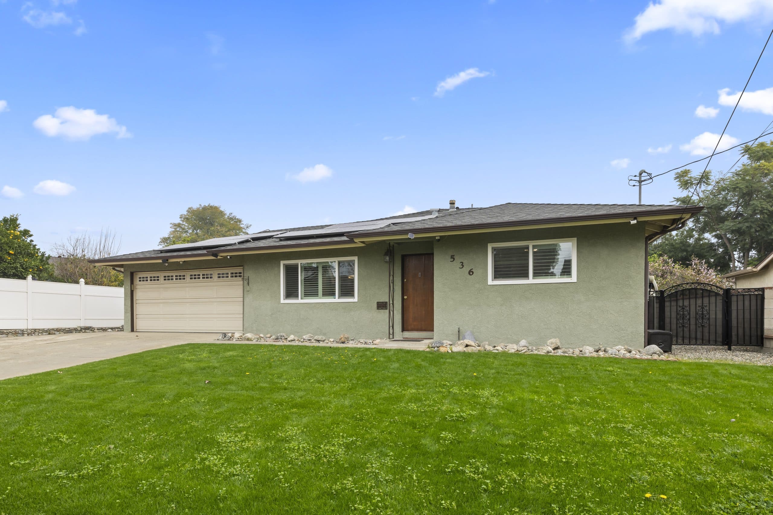 Well-kept mid-century Claremont home with a broad lawn in full sun