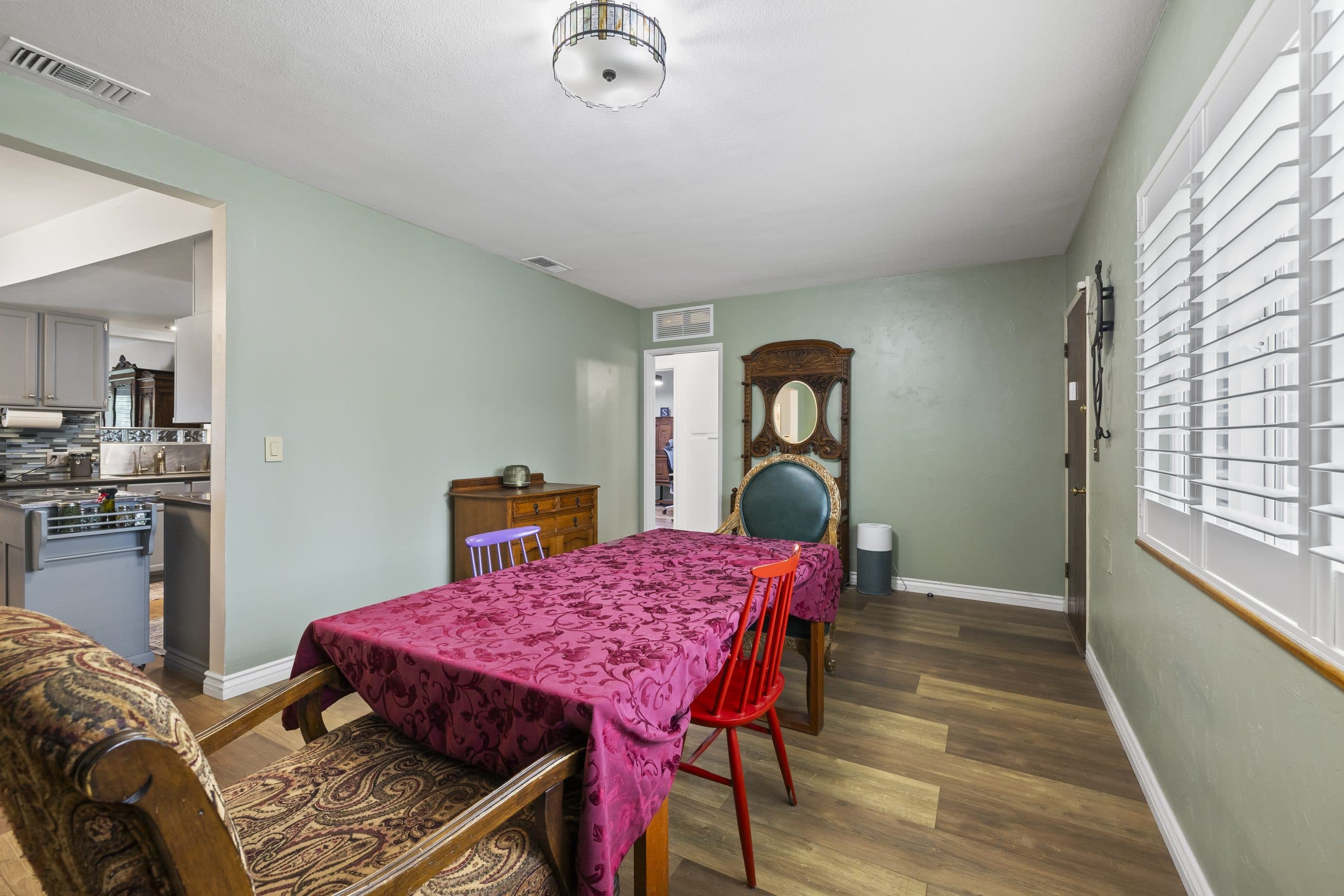 Dining room opening to the kitchen in a Claremont home