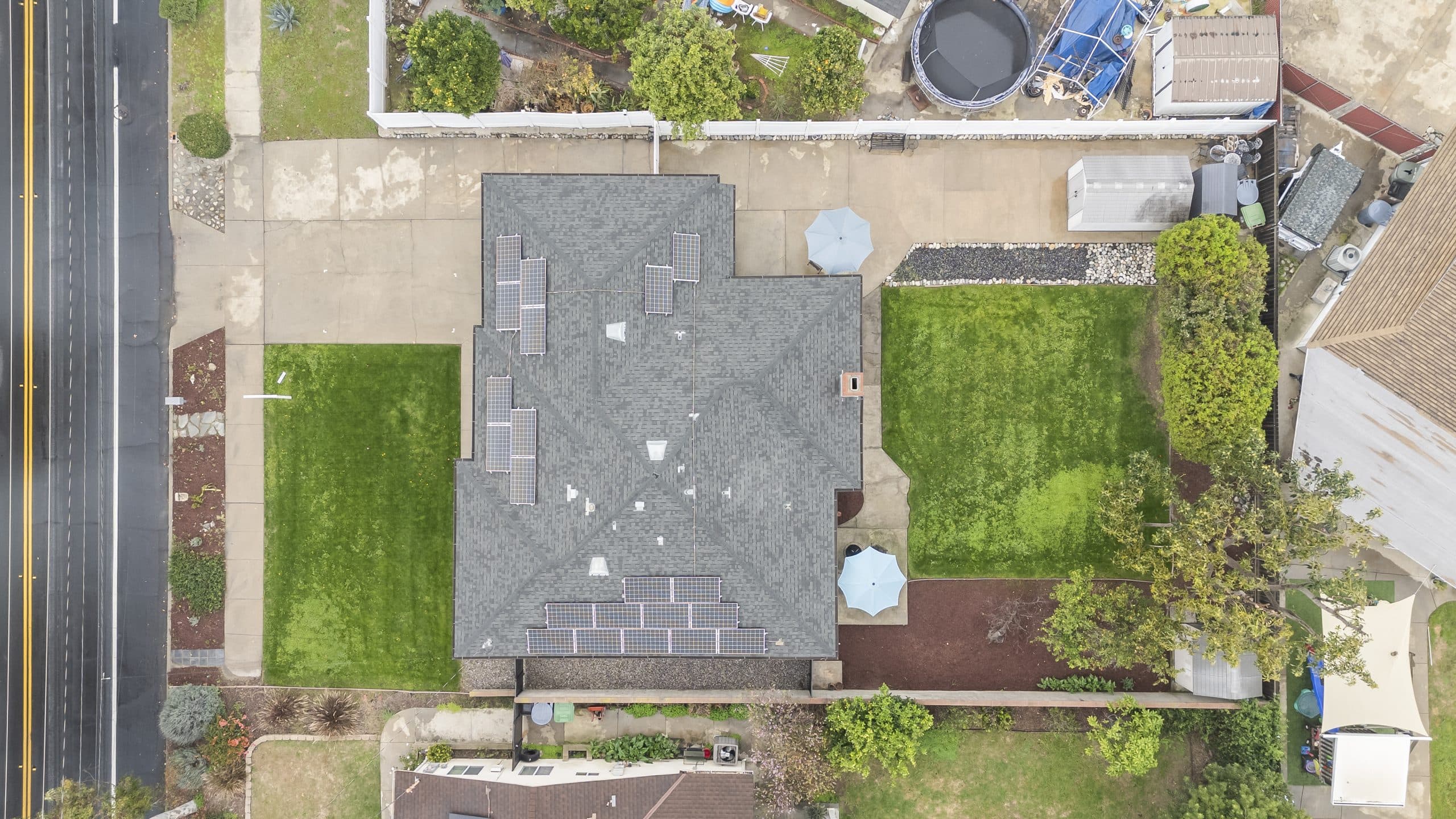 Overhead view of a Claremont home's roof and tree-lined parcel