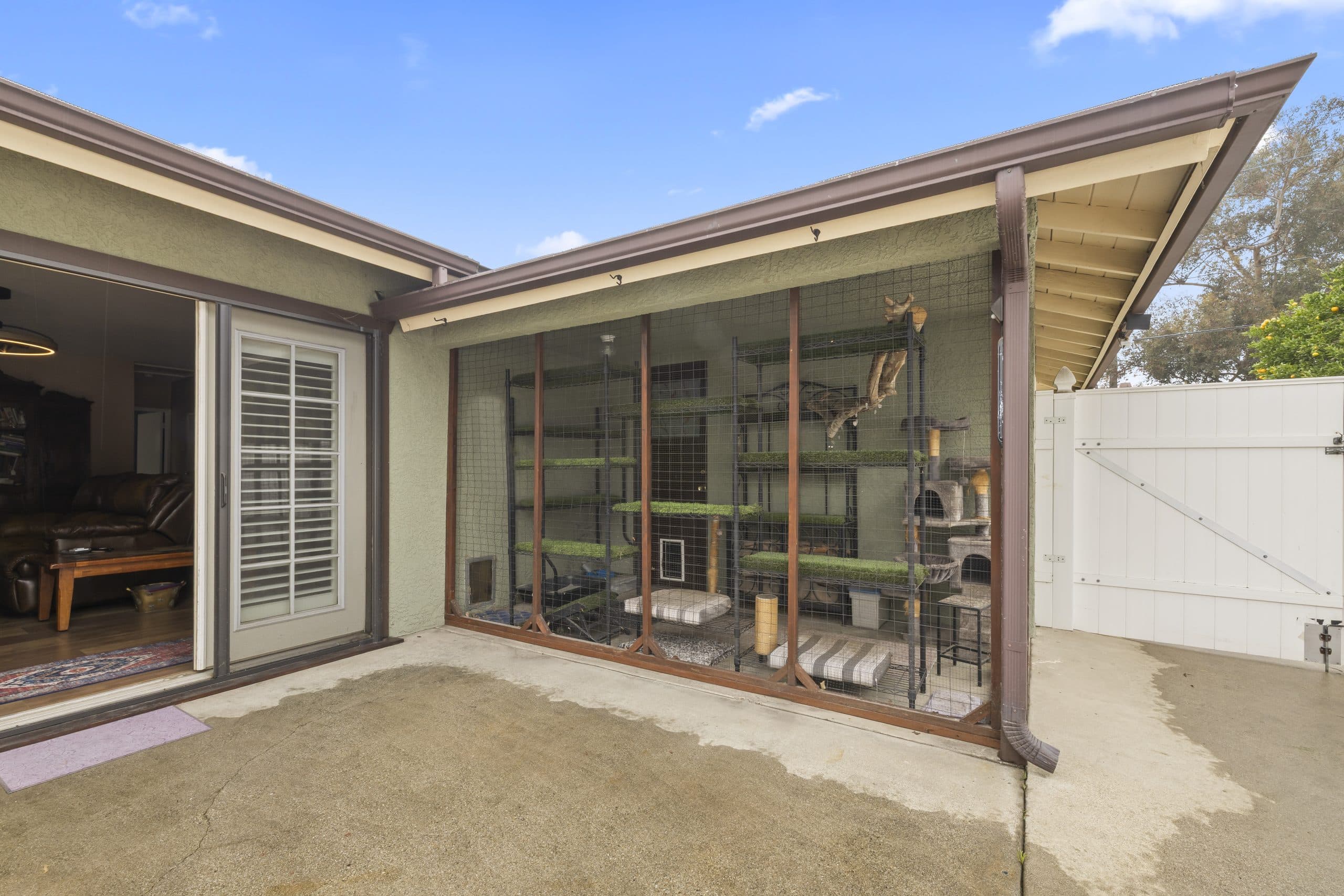 Backyard patio and screened enclosure at a Claremont home