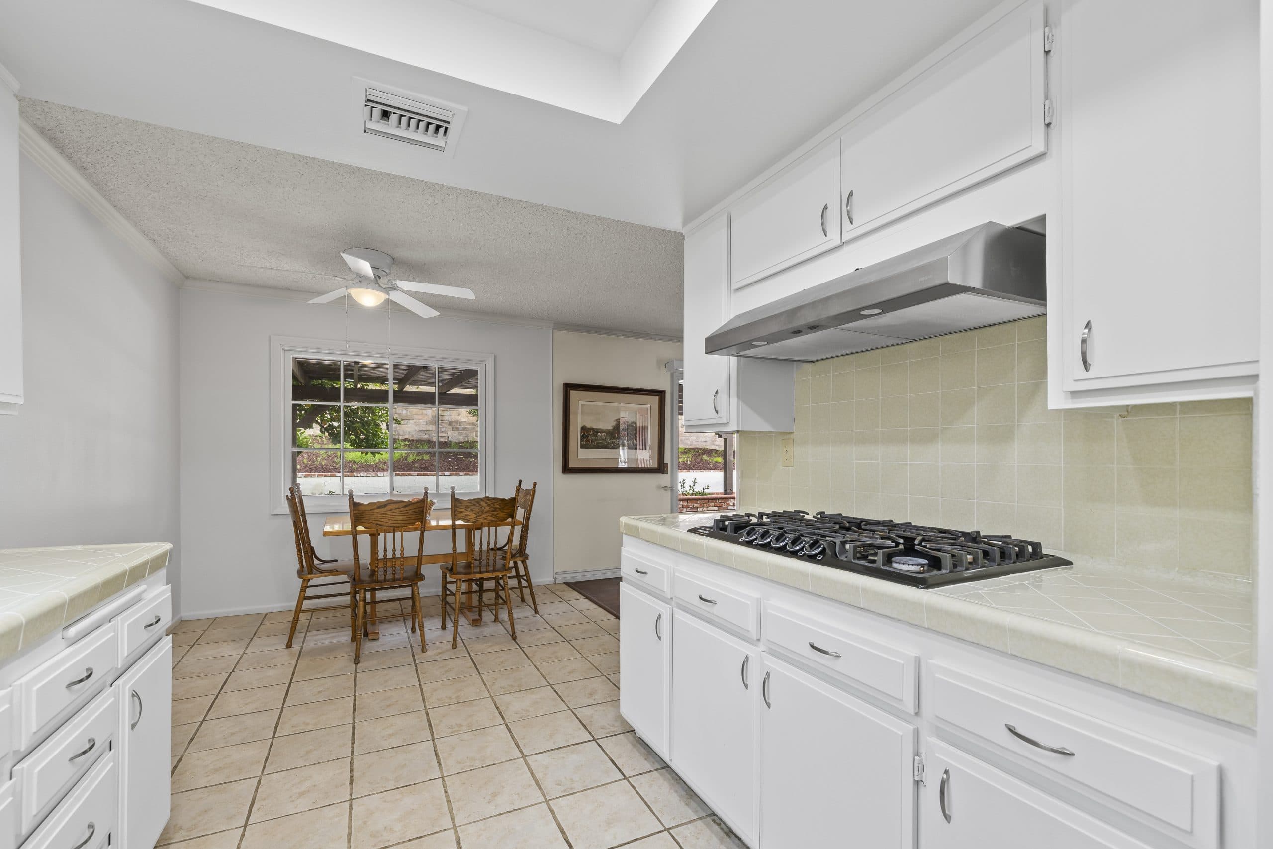 Bright galley kitchen with a breakfast nook in a Claremont home