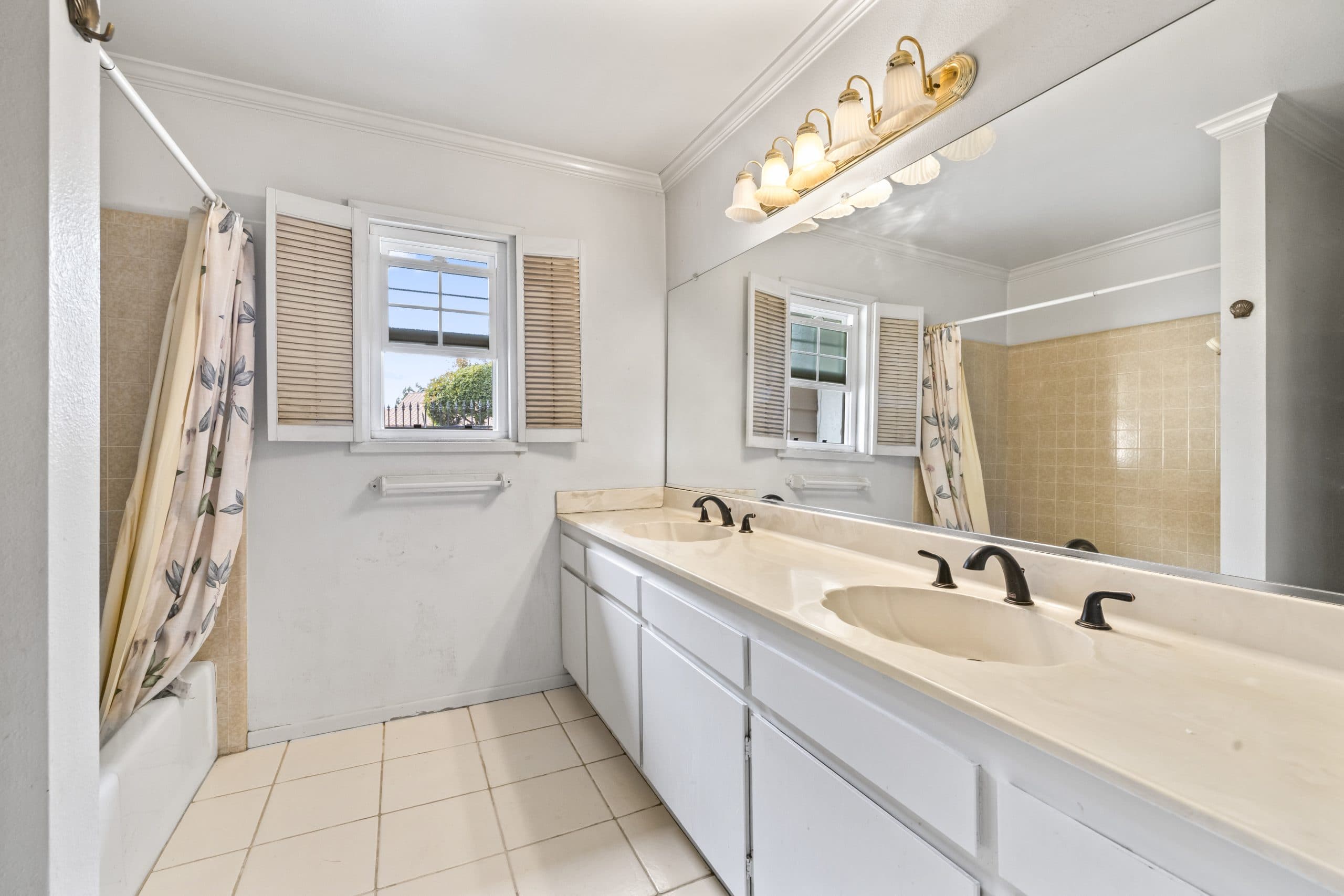 Hall bathroom with original-era fixtures in a Claremont home