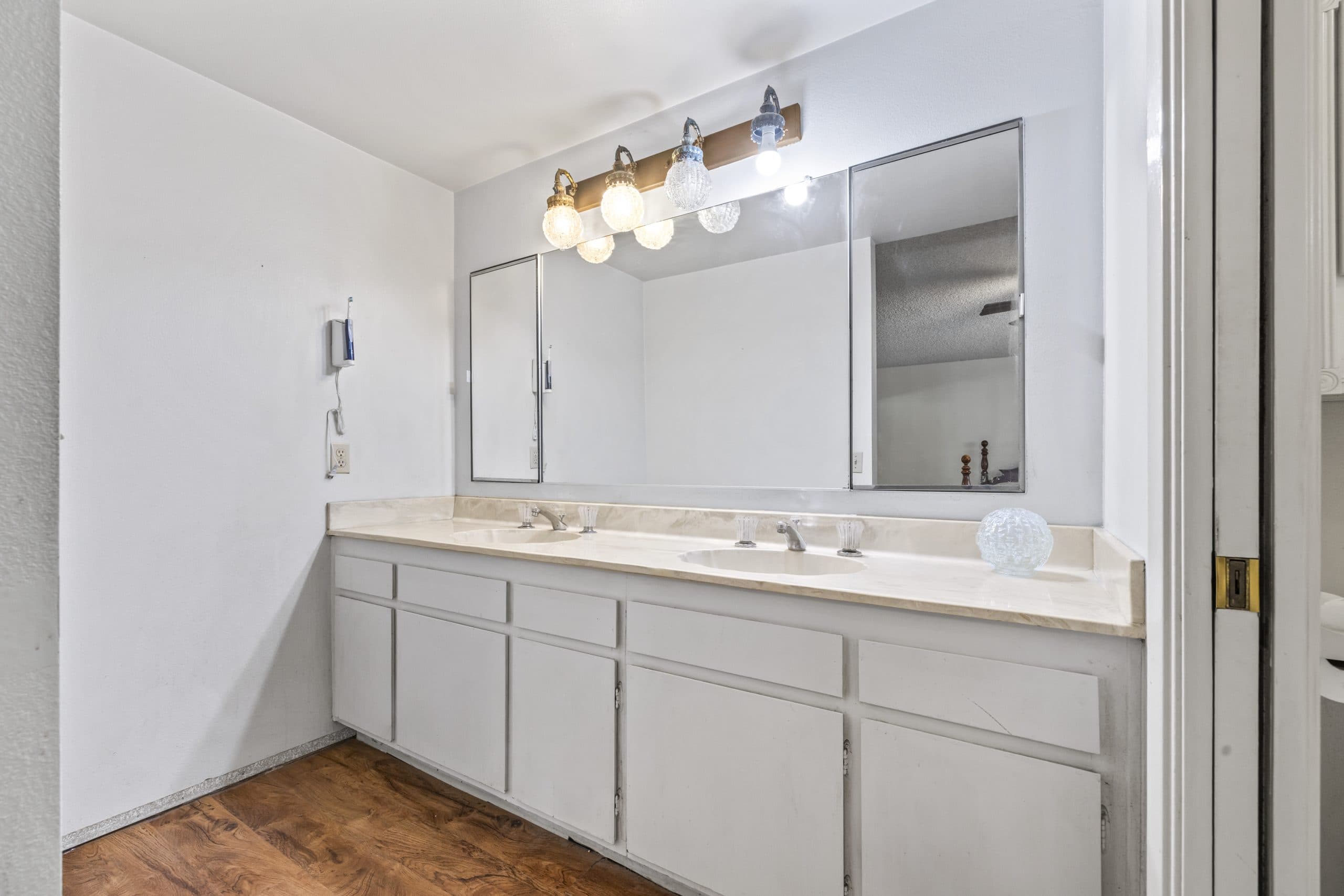 Dated double-vanity bathroom in a Claremont home