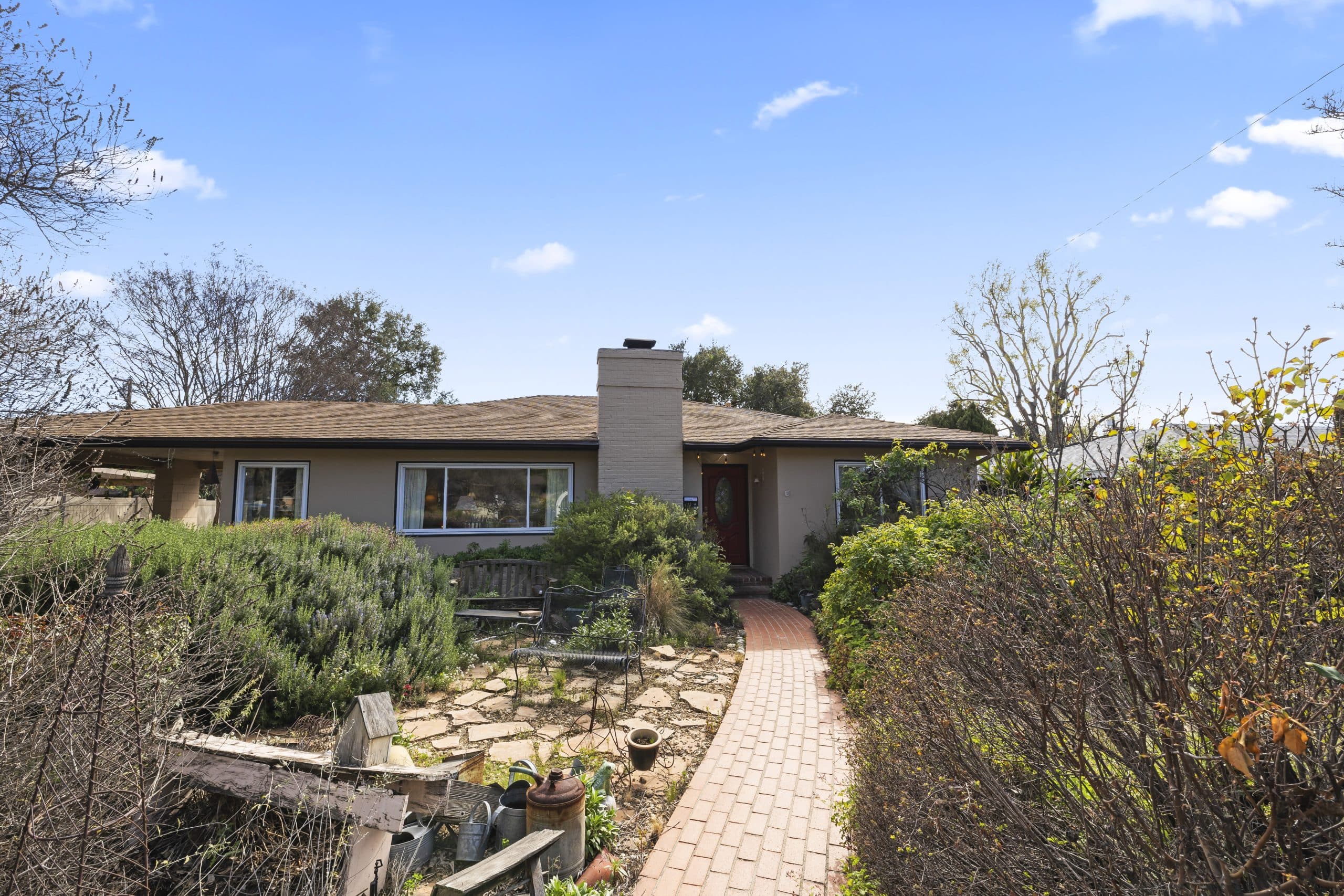 Long-established single-story Claremont home with mature garden and brick path