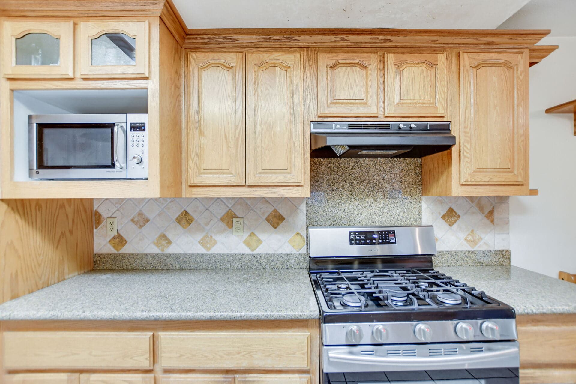 Updated kitchen with granite counters in a Claremont home