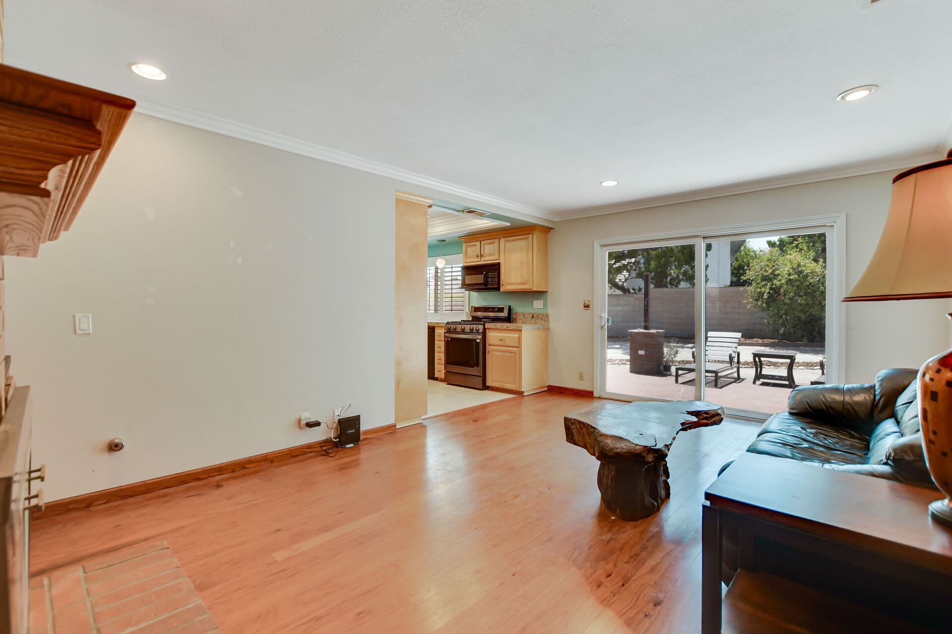 Open-plan Claremont living space with sliding door to a private patio