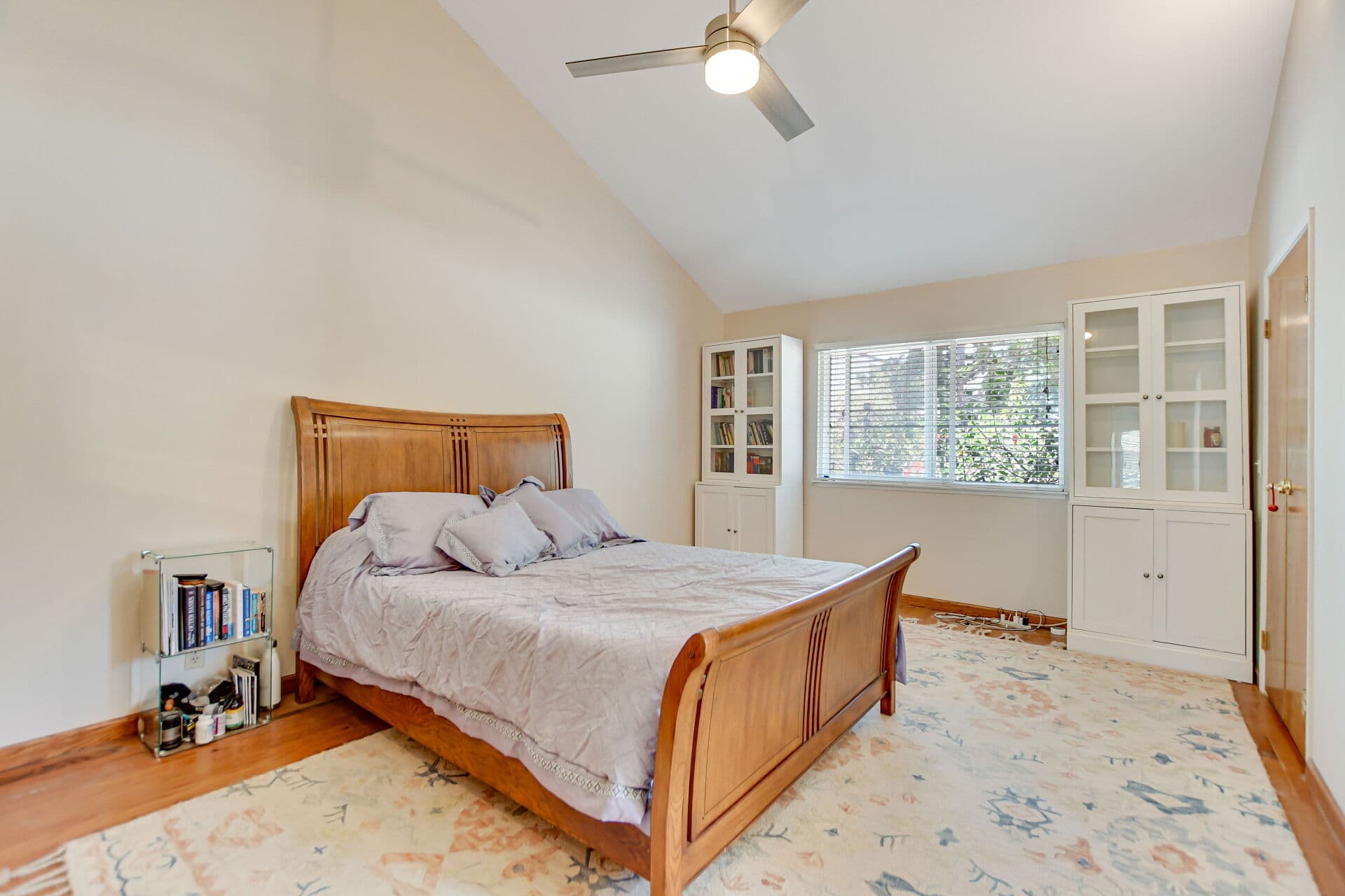 Bedroom with an oak sleigh bed in a Claremont home