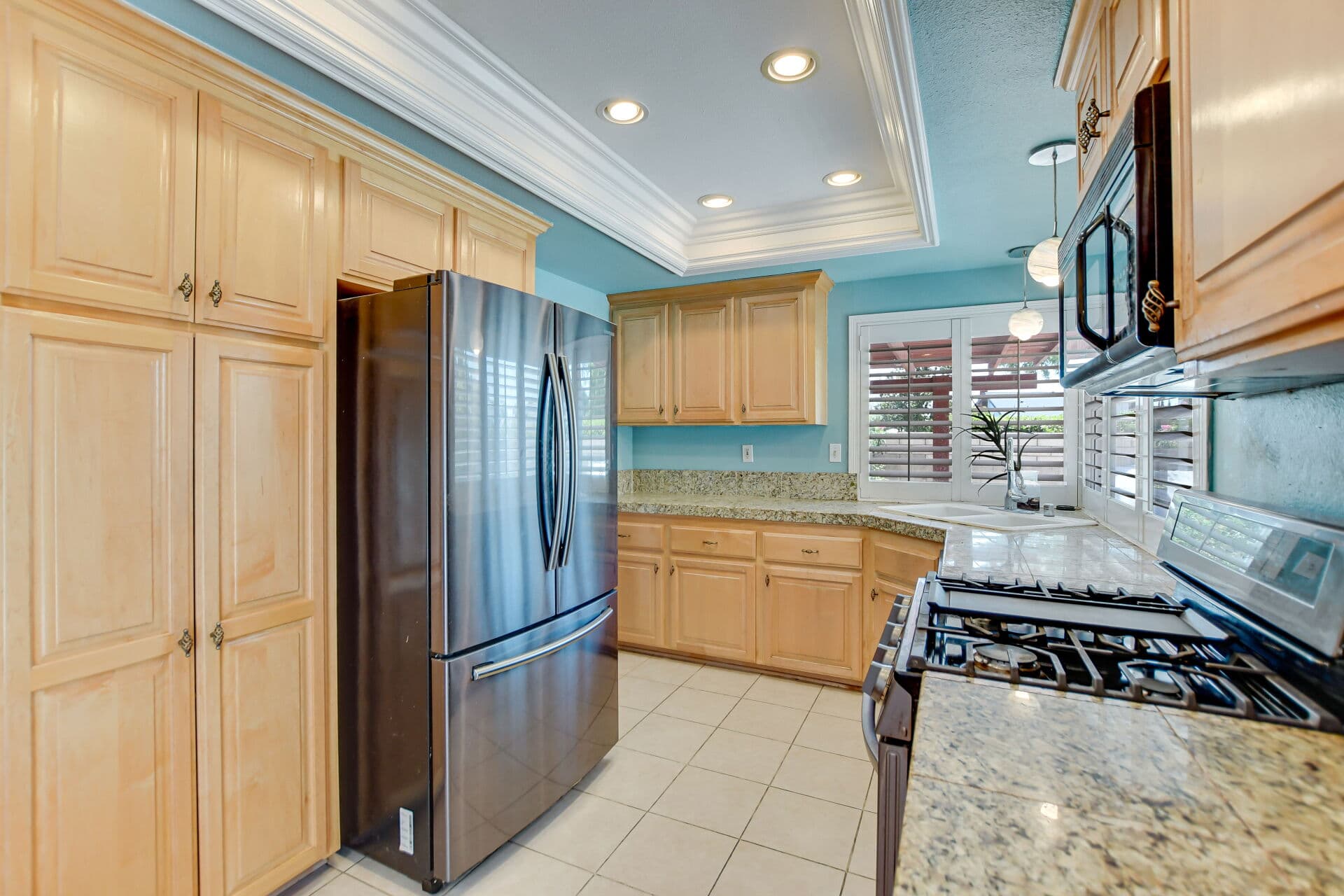 Freshly finished Claremont kitchen with recessed lighting and granite counters
