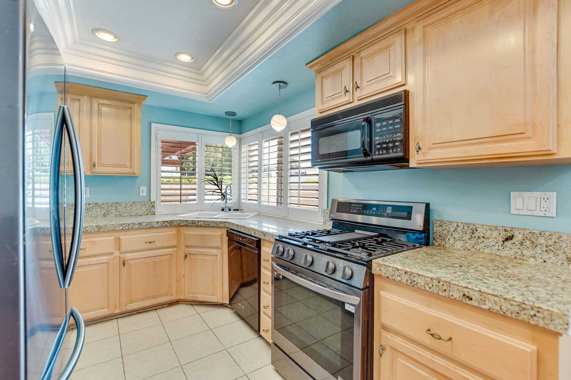 Updated Claremont kitchen with granite counters and stainless appliances