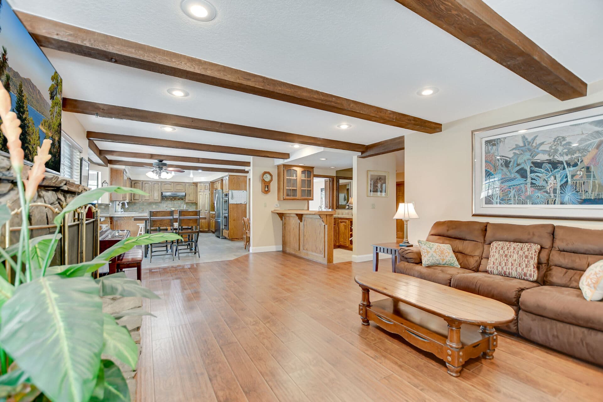 Furnished Claremont living room with exposed wood beams, a home waiting to go back on the market