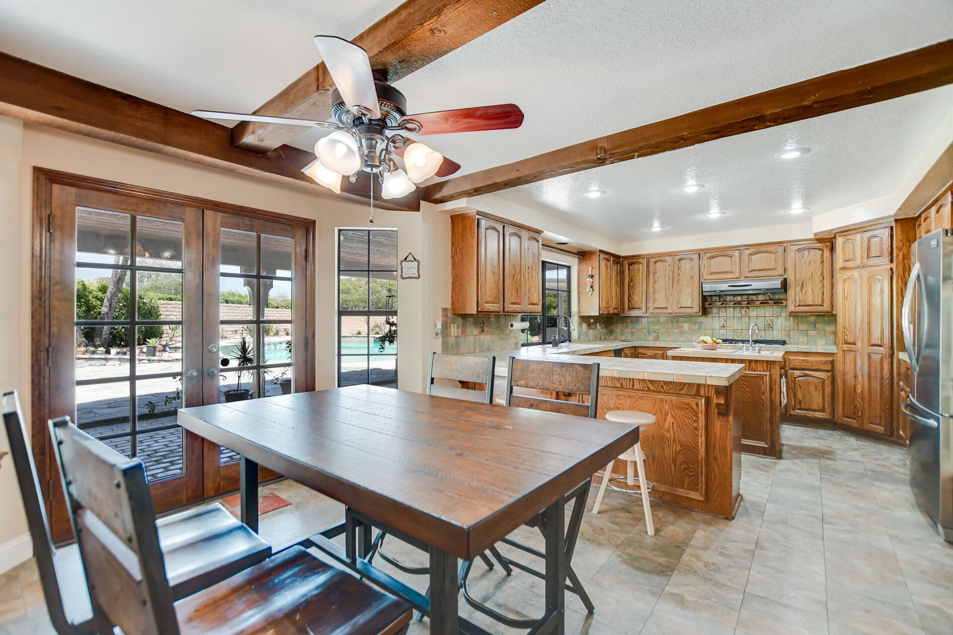 Breakfast nook with French doors opening to the patio in a Claremont home