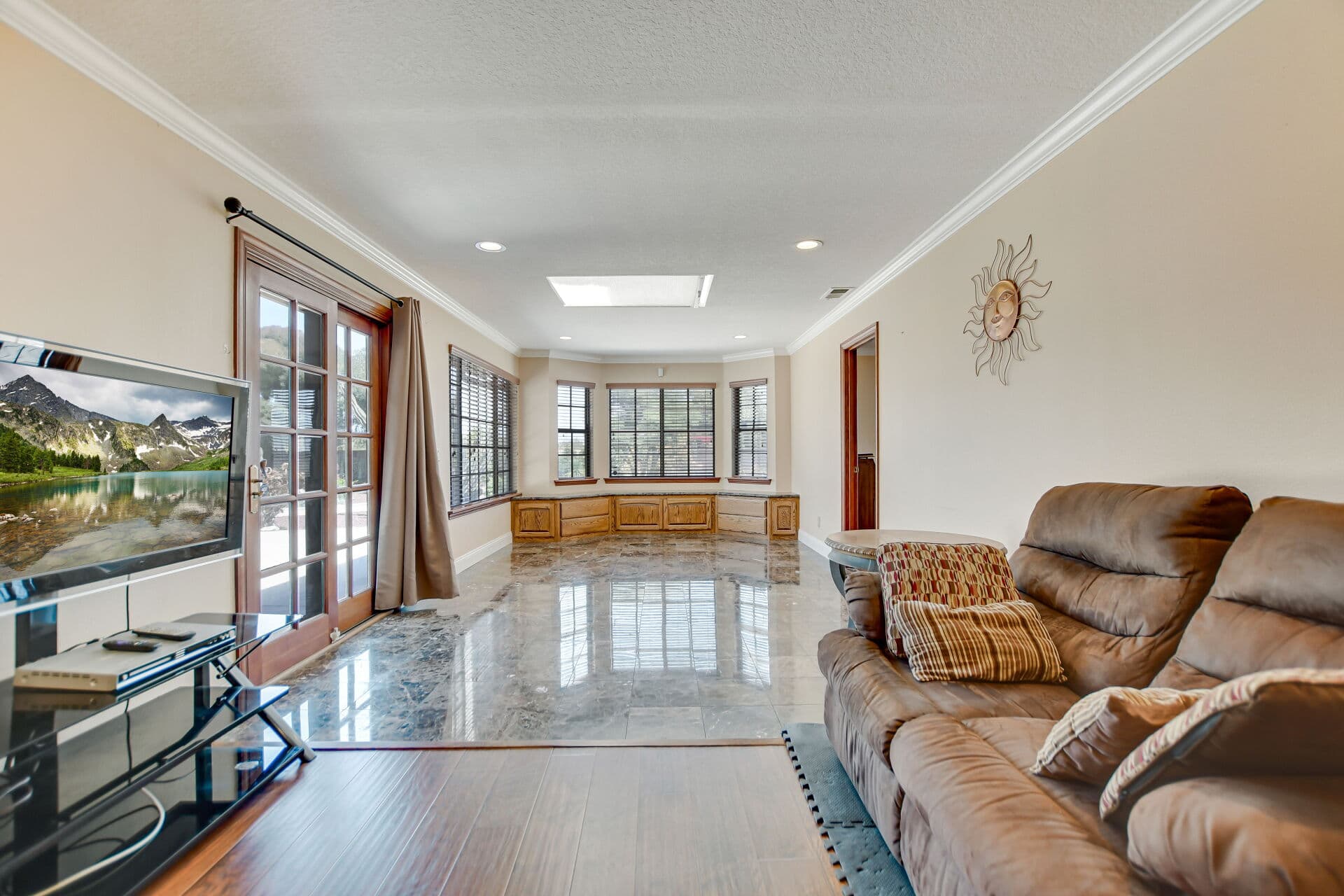 Family room with a built-in oak window seat in a Claremont home