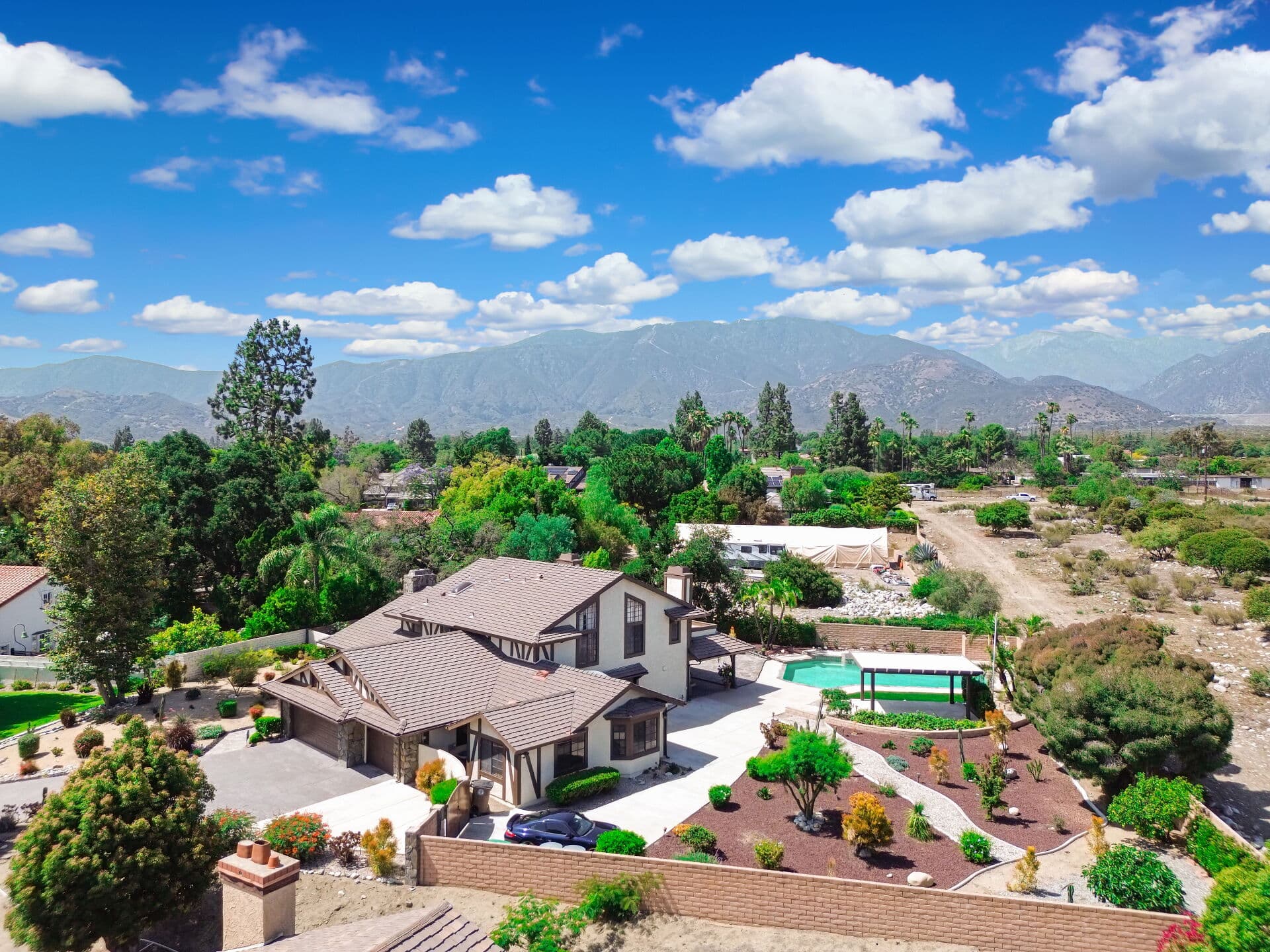 Aerial view of a Claremont home with pool and the San Gabriel Mountains beyond