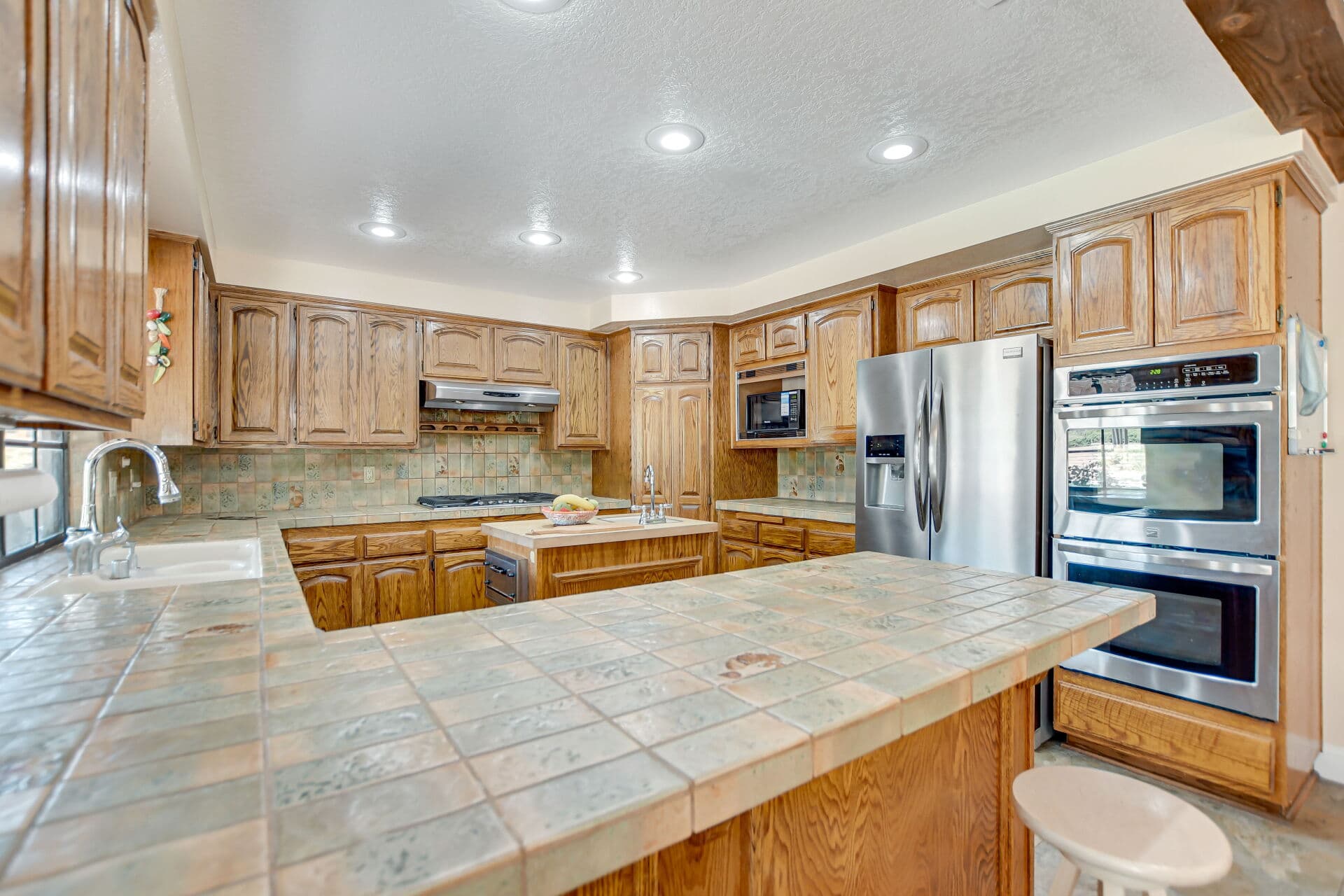Kitchen with a stainless double wall oven and appliances in a Claremont home