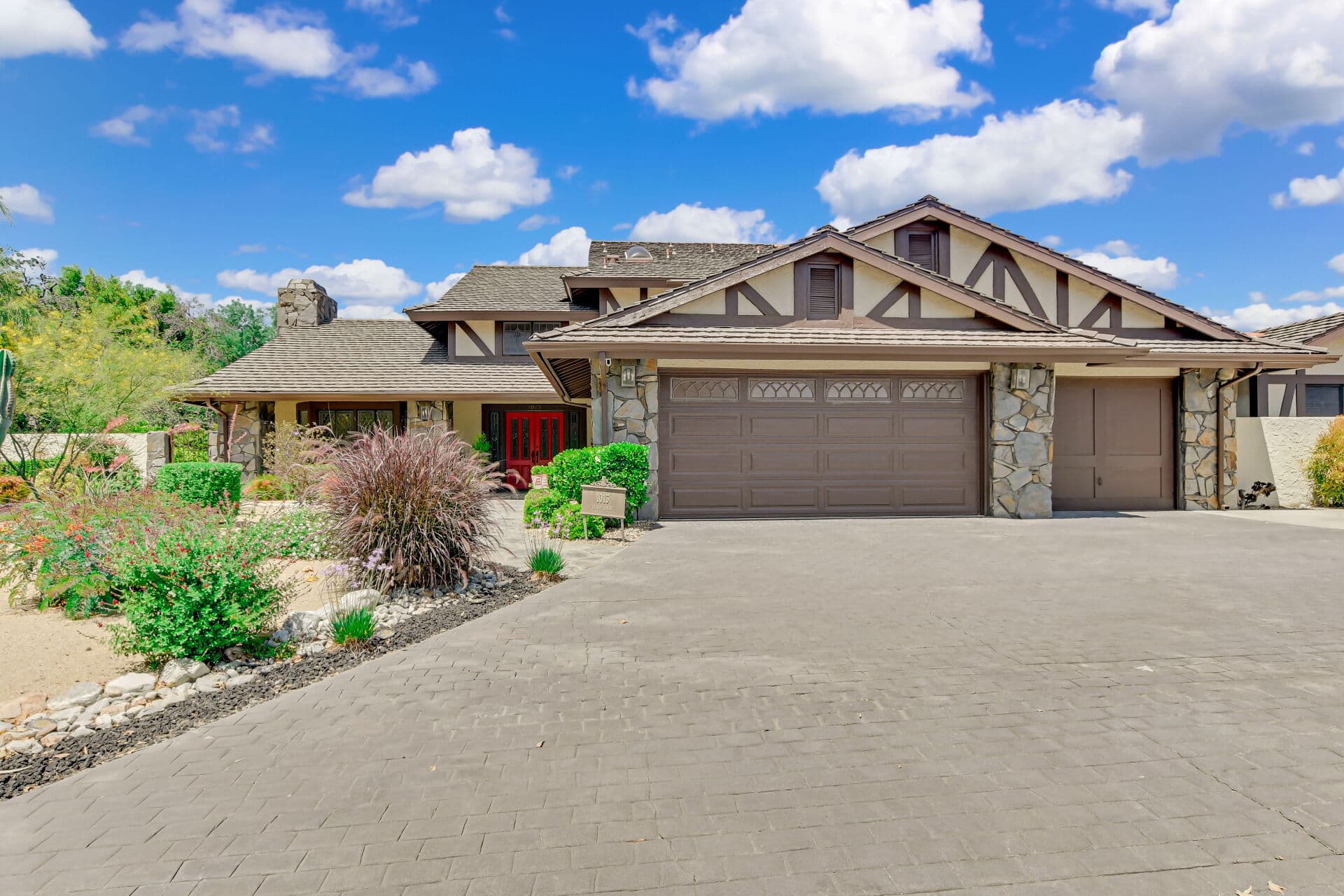 Street-level front view of a Claremont home with a prominent garage