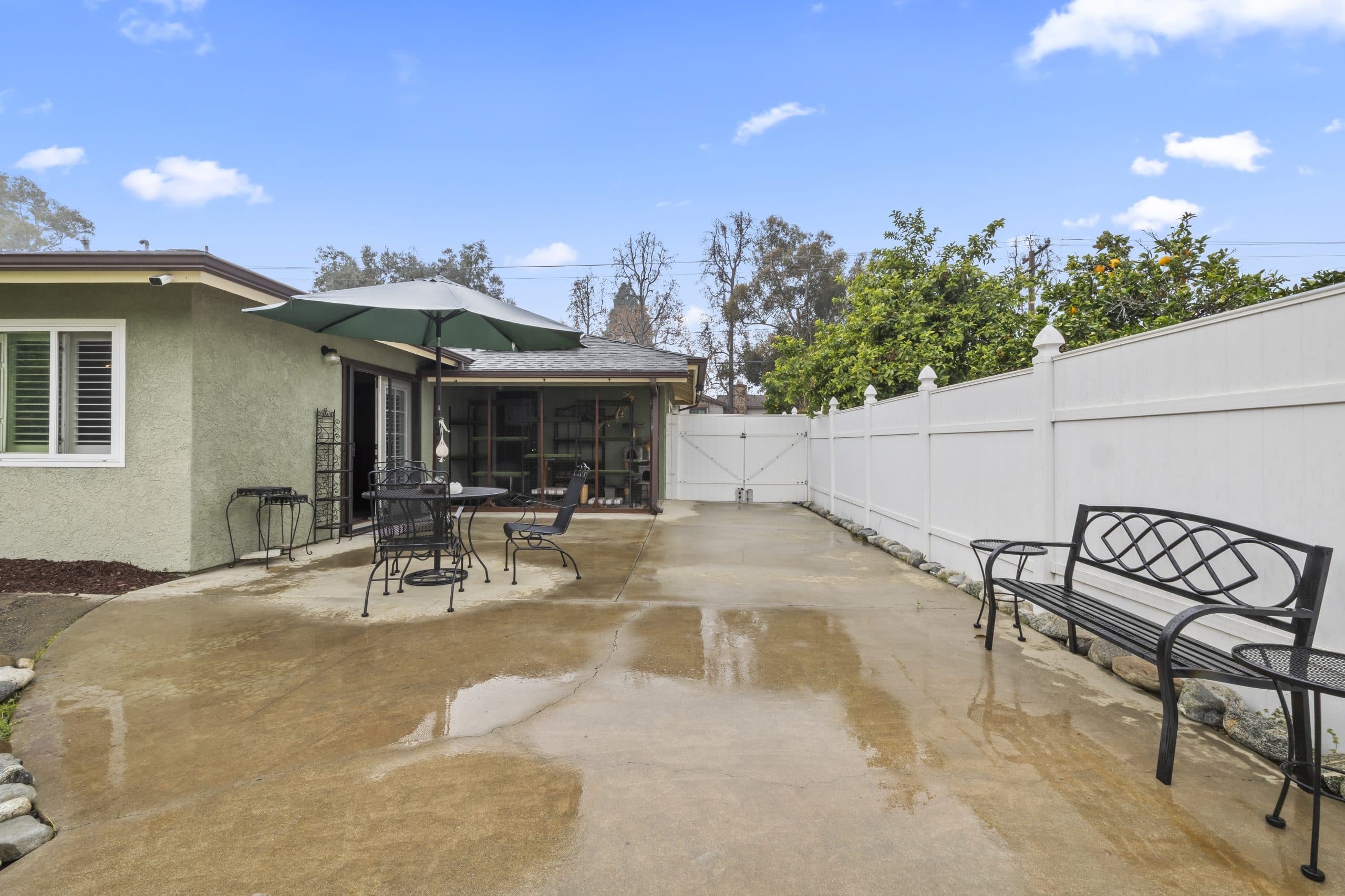 Rear patio running along the fence line of a Claremont home