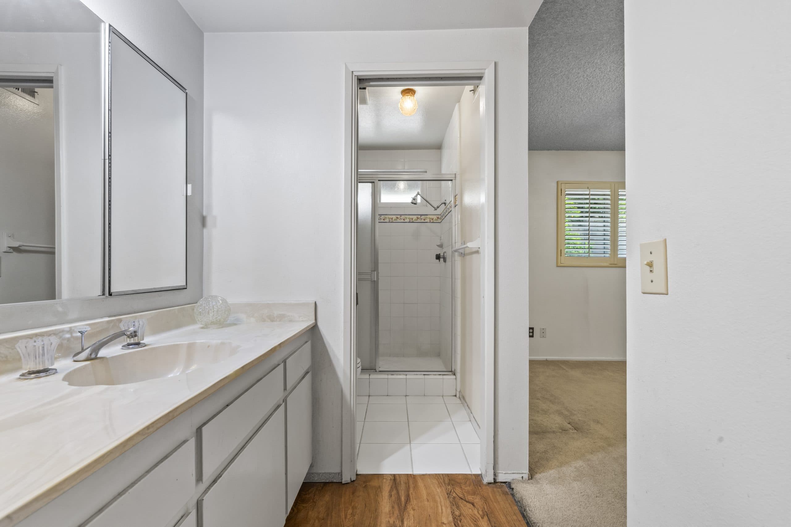 Vanity nook and tiled shower in a Claremont home
