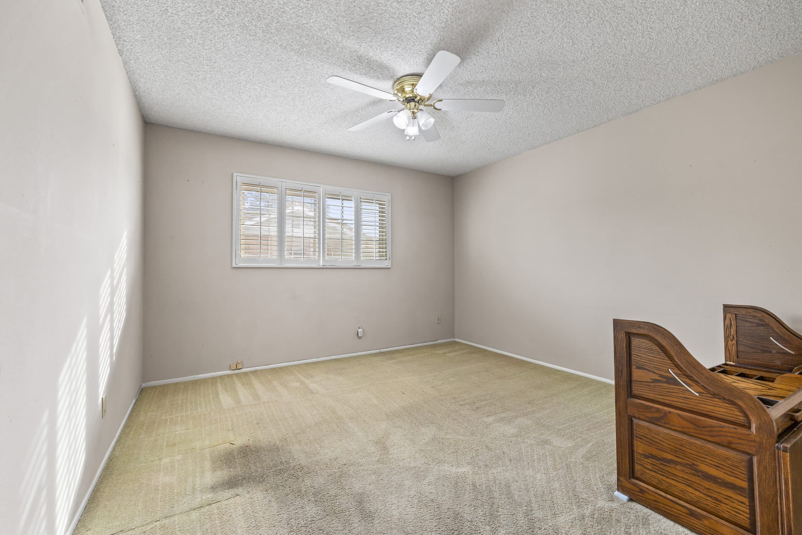 Room in a Claremont home with an oak roll-top writing desk