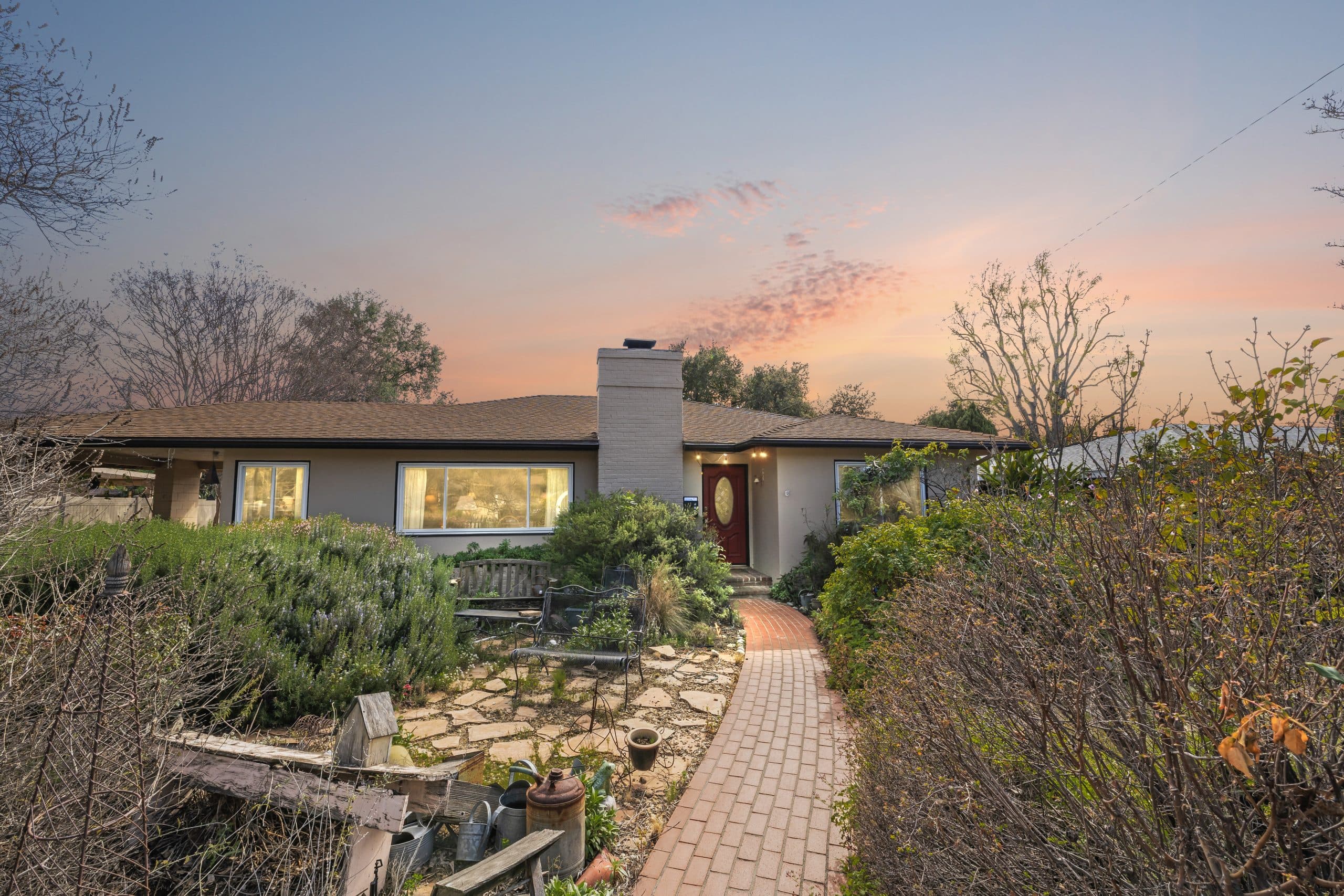 Arriving at a Claremont home at sunset along a brick path