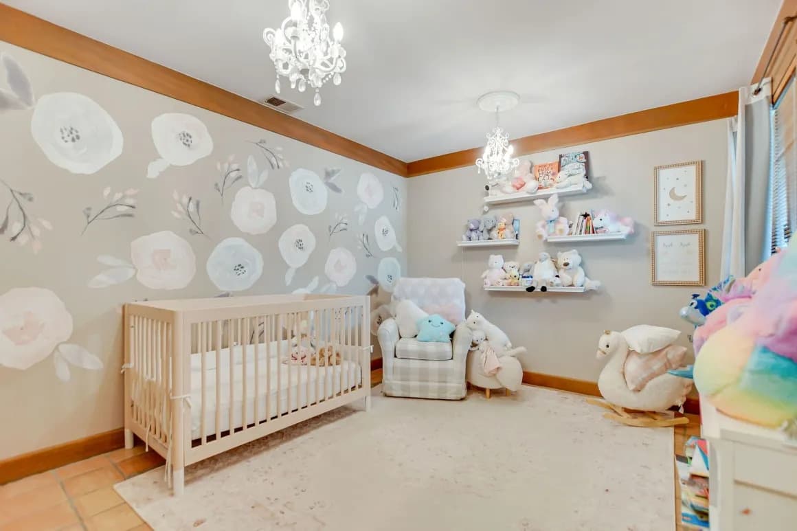 Nursery bedroom with wood trim in a Claremont home