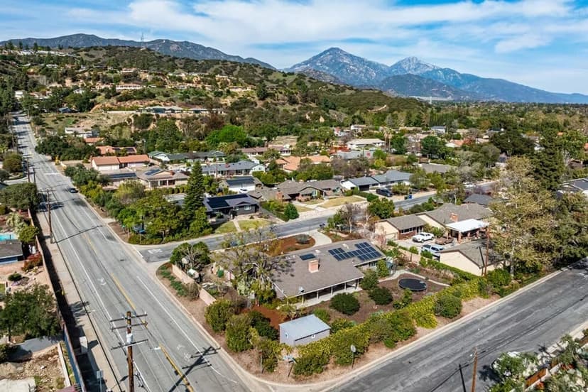Aerial view of North Claremont homes against the San Gabriel Mountains